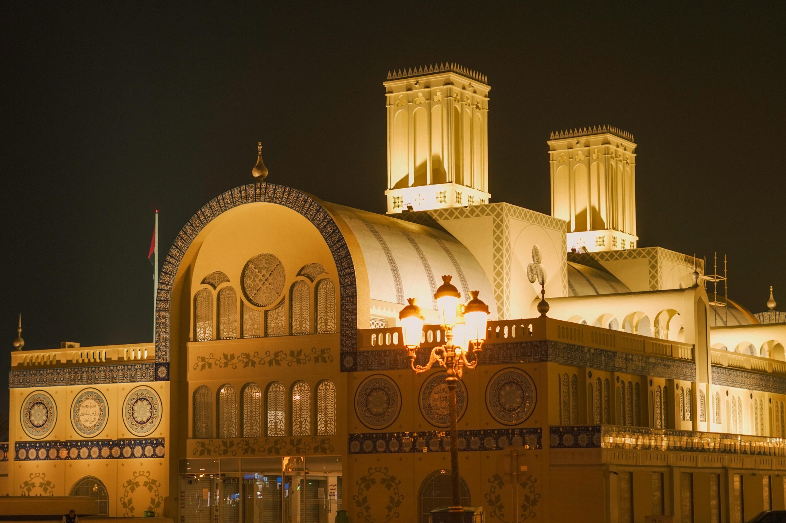 Services Night view of the illuminated Sharjah Central Souq in the United Arab Emirates.